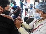 A healthcare worker administers the Covid-19 vaccine dose to a shopkeeper in Bhopal, on Tuesday.(File Photo / PTI) A healthcare worker administers the Covid-19 vaccine dose to a shopkeeper in Bhopal, on Tuesday.(File Photo / PTI)