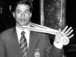 In this file photo circa 1998, boxer Dingko Singh shows his gold medal. 