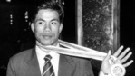 In this file photo circa 1998, boxer Dingko Singh shows his gold medal. (PTI) In this file photo circa 1998, boxer Dingko Singh shows his gold medal. (PTI)