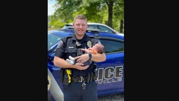 The image shows 23-year-old officer Hubbard who saved the baby's life in USA's Arkansas.