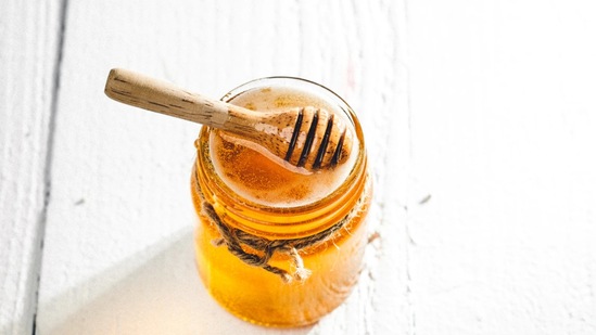 Honey: This is a great moisturiser and has antimicrobial and antibacterial properties. It can help heal and cleanse wounds as well as moisturise the skin. You can apply it as a foot mask overnight. (Unsplash)