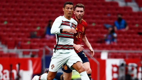 Portugal's Cristiano Ronaldo in action with Spain's Aymeric Laporte. (REUTERS)