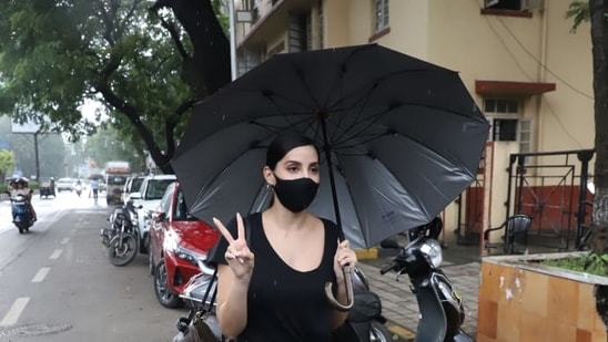 Nora Fatehi posing for photographers.