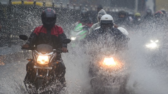 indiaCommuters make their way through the waterlogged road during heavy rain, at Kings Circle, in Mumbai, on June 9 (PTI) indiaCommuters make their way through the waterlogged road during heavy rain, at Kings Circle, in Mumbai, on June 9 (PTI)