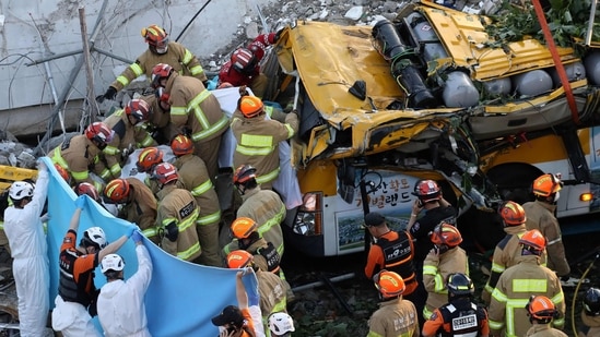 South Korean rescue workers search for possible survivors from the debris of a collapsed building in Gwangju on June 9, 2021. (AFP) South Korean rescue workers search for possible survivors from the debris of a collapsed building in Gwangju on June 9, 2021. (AFP)