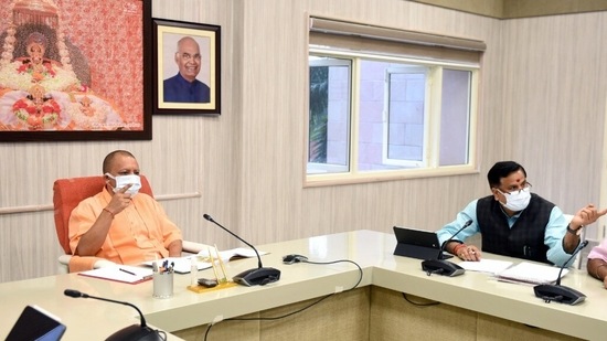 Uttar Pradesh chief minister Yogi Adityanath holding a meeting in Lucknow on Wednesday.(PTI Photo)