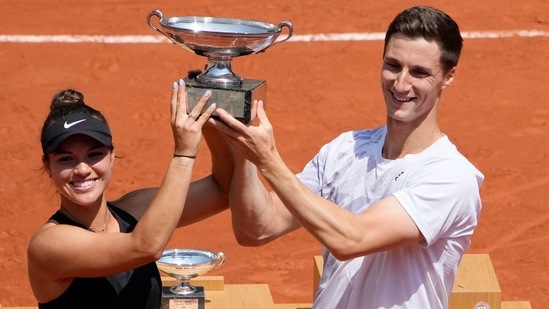 USA's Desirae Krawczyk, left, and Britain's Joe Salisbury hold the cup after defeating Russia's Elena Vesnina and Aslan Karatsev in their mixed doubles final match of the French Open tennis tournament at the Roland Garros stadium Thursday, June 10, 2021 in Paris. (AP) USA's Desirae Krawczyk, left, and Britain's Joe Salisbury hold the cup after defeating Russia's Elena Vesnina and Aslan Karatsev in their mixed doubles final match of the French Open tennis tournament at the Roland Garros stadium Thursday, June 10, 2021 in Paris. (AP)