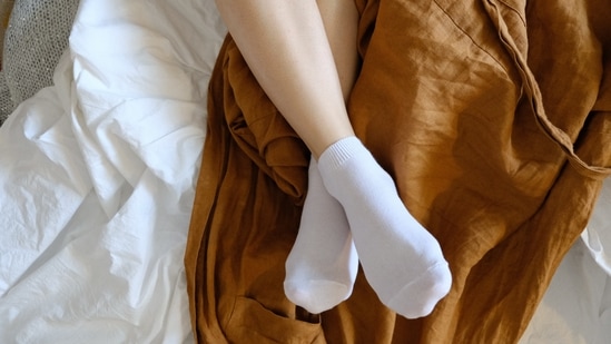 Wear cotton socks to bed: Before going to bed, apply a thick layer of petroleum jelly and wear 100% cotton socks to keep the moisture in and at the same time allow the skin to breathe(Unsplash)
