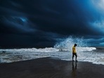 Dark monsoon clouds loom as waves lash the shores during high tide at Bandra in Mumbai on June 11. The India Meteorological Department (IMD) had declared the arrival of the south-west monsoon in Mumbai on June 9, two days prior to the official onset date.