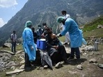 A healthcare worker administers a dose of COVISHIELD, a coronavirus disease (Covid-19) vaccine manufactured by Serum Institute of India, to a shepherd man during a vaccination drive at Lidderwat near scenic Pahalgam in south Kashmir's Anantnag district.