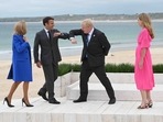 French President Emmanuel Macron (2nd L) and his wife Brigitte Macron (L) are greeted by British Prime Minister Boris Johnson (2nd R) and his wife Carrie Johnson (R) at the start of the G7 summit in Carbis Bay, Cornwall. French President Emmanuel Macron (2nd L) and his wife Brigitte Macron (L) are greeted by British Prime Minister Boris Johnson (2nd R) and his wife Carrie Johnson (R) at the start of the G7 summit in Carbis Bay, Cornwall.