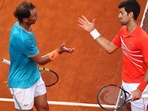 File Photo of Rafael Nadal and Novak Djokovic (right) greeting each other during the 2020 French Open final. 