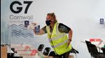 A woman cleans anti-coronavirus disease (Covid-19) screens on desks at a media centre inside the National Maritime Museum, as preparations are underway for the G7 leaders summit, Falmouth, Cornwall, Britain. (REUTERS) A woman cleans anti-coronavirus disease (Covid-19) screens on desks at a media centre inside the National Maritime Museum, as preparations are underway for the G7 leaders summit, Falmouth, Cornwall, Britain. (REUTERS)