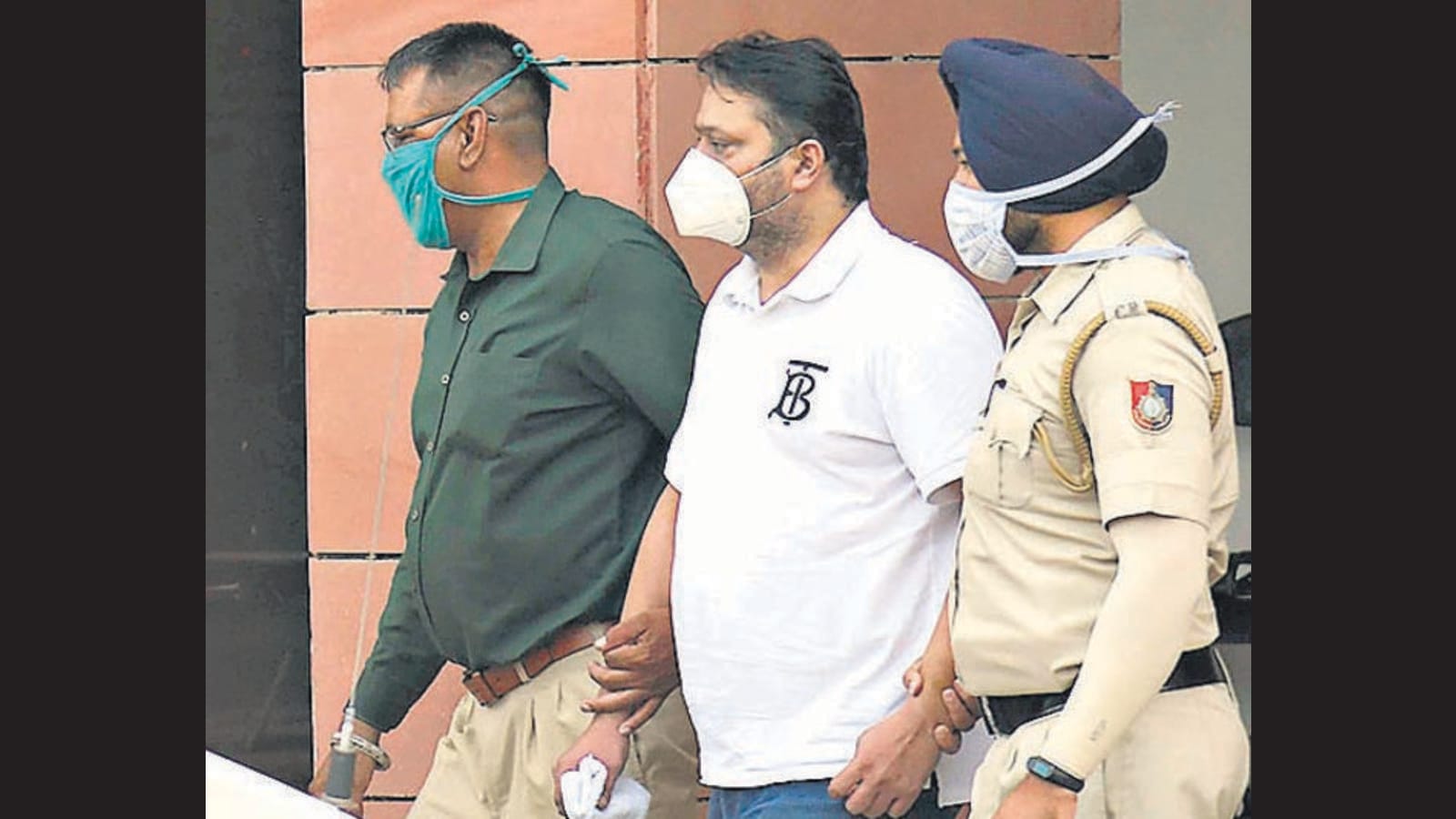 Chandigarh house grab case Liquor baron surrenders in court