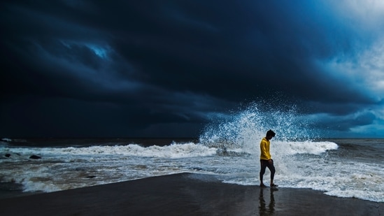 Dark monsoon clouds loom as waves lash the shores during high tide at Bandra in Mumbai on June 11. The India Meteorological Department (IMD) had declared the arrival of the south-west monsoon in Mumbai on June 9, two days prior to the official onset date.(Pratik Chorge / HT Photo)
