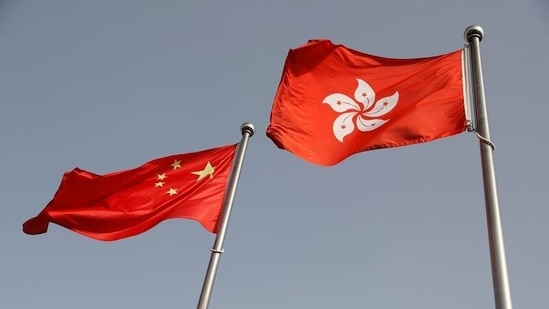FILE PHOTO: The Chinese and Hong Kong flags flutter at the office of the Government of the Hong Kong Special Administrative Region. (REUTERS)