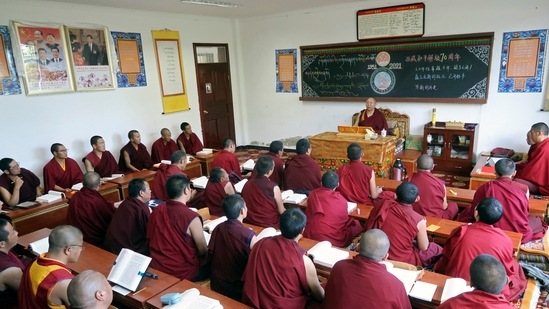 Tibetan Buddhist monks attend a class during a government-organised media tour in Lhasa, Tibet Autonomous Region, China.(Reuters)