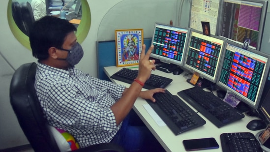 Shareholders and brokers react as Sensex and Nifty reach record highs in Kolkata. (ANI) Shareholders and brokers react as Sensex and Nifty reach record highs in Kolkata. (ANI)