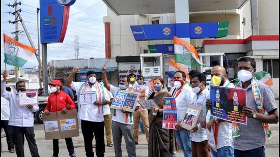 Congress activists protest against frequent hikes in the prices of petrol and diesel, and demand rollback of the prices at a fuel station, in Chikmagalur, Karnataka on Friday, June 11. (PTI) Congress activists protest against frequent hikes in the prices of petrol and diesel, and demand rollback of the prices at a fuel station, in Chikmagalur, Karnataka on Friday, June 11. (PTI)