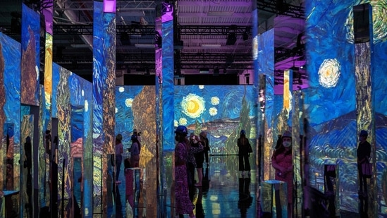 People attend a media preview of the "Immersive van Gogh" exhibit at Pier 36 on May 26, 2021 in New York City. - (AFP)