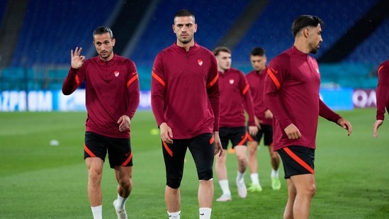 Turkey's Merih Demiral, center, works out with teammates during a training session of the national team at the Olympic stadium in Rome. Turkey's Merih Demiral, center, works out with teammates during a training session of the national team at the Olympic stadium in Rome.