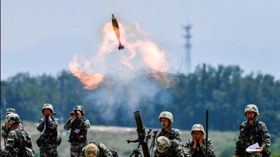 Soldiers of Chinese People's Liberation Army fire a mortar during a live-fire exercise in Anhui province, China. (REUTERS) Soldiers of Chinese People's Liberation Army fire a mortar during a live-fire exercise in Anhui province, China. (REUTERS)