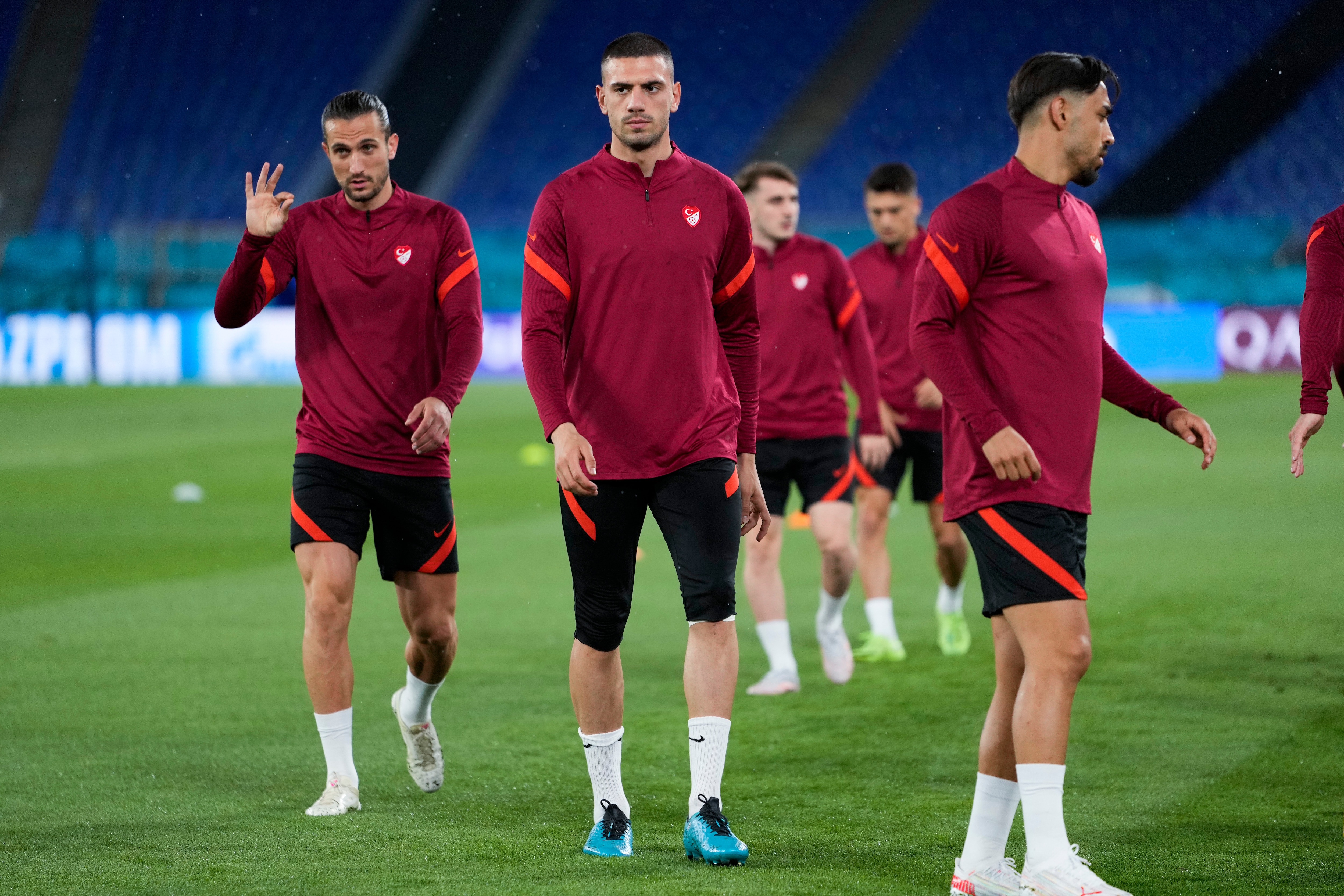 Turkey's Merih Demiral, center, works out with teammates during a training session of the national team at the Olympic stadium in Rome. Turkey's Merih Demiral, center, works out with teammates during a training session of the national team at the Olympic stadium in Rome.