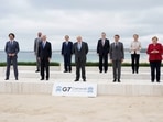 G7 leaders and top EU officials pose for a group photo at the G7 summit, in Carbis Bay, Britain.