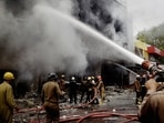Firefighters attempt to douse a blaze in a showroom at Lajpat Nagar's Central Market area, in New Delhi.(PTI) Firefighters attempt to douse a blaze in a showroom at Lajpat Nagar's Central Market area, in New Delhi.(PTI)