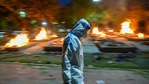 A man in PPE coveralls walks past funeral pyres of Covid-19 victims, at Sarai Kale Khan crematorium, in New Delhi, India, on Wednesday, April 28, 2021. (Photo by Amal KS/ Hindustan Times) A man in PPE coveralls walks past funeral pyres of Covid-19 victims, at Sarai Kale Khan crematorium, in New Delhi, India, on Wednesday, April 28, 2021. (Photo by Amal KS/ Hindustan Times)