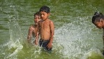 New Delhi, India - June 12, 2021: Children bathing in a pool at Boat Club near Vijay chowk on a hot summer day on in New Delhi, India, on Saturday, June 12, 2021. (Raj K Raj / HT Photo) New Delhi, India - June 12, 2021: Children bathing in a pool at Boat Club near Vijay chowk on a hot summer day on in New Delhi, India, on Saturday, June 12, 2021. (Raj K Raj / HT Photo)