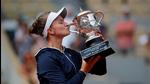 Czech Republic's Barbora Krejcikova celebrates with the trophy after winning the French Open final match against Russia's Anastasia Pavlyuchenkova. (REUTERS) Czech Republic's Barbora Krejcikova celebrates with the trophy after winning the French Open final match against Russia's Anastasia Pavlyuchenkova. (REUTERS)