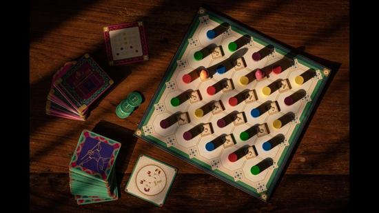 Ettana uses design cards, action cards and tokens representing yarn to move the game forward.