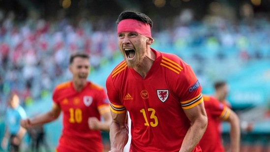 Kieffer Moore celebrates after scoring his side's opening goal during the Euro 2020 soccer championship group A match between Wales and Switzerland.(AP)