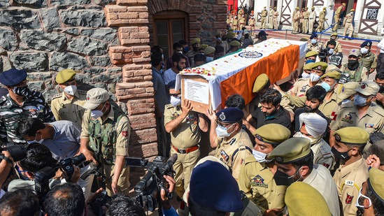 Senior police officers carry the coffin of constable Showket Ahmad and Waseem Ahmad after wreath laying ceremony in Srinagar.(PTI) Senior police officers carry the coffin of constable Showket Ahmad and Waseem Ahmad after wreath laying ceremony in Srinagar.(PTI)