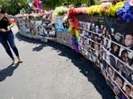 A visitor looks over a display with the photos and names of the 49 victims that died at the Pulse nightclub memorial.(AP) A visitor looks over a display with the photos and names of the 49 victims that died at the Pulse nightclub memorial.(AP)