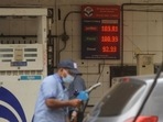 An attendant at a petrol pump fills the fuel tanks of motorists with rates displayed behind him on a digital screen, in Mumbai on Saturday.(Vijay Bate/HT Photo) An attendant at a petrol pump fills the fuel tanks of motorists with rates displayed behind him on a digital screen, in Mumbai on Saturday.(Vijay Bate/HT Photo)