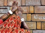 A devotee prays to the bricks expected to be used in construction of the Ram temple, in Ayodhya on November 11, 2019. 