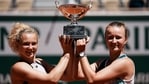 Czech Republic's Barbora Krejcikova, right, and compatriot Katerina Siniakova hold the cup after defeating USA's Bethanie Mattek-Sands and Poland's Iga Swiatek in their women's doubles final match of the French Open.(AP) Czech Republic's Barbora Krejcikova, right, and compatriot Katerina Siniakova hold the cup after defeating USA's Bethanie Mattek-Sands and Poland's Iga Swiatek in their women's doubles final match of the French Open.(AP)