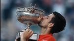 Novak Djokovic kisses the cup after defeating Stefanos Tsitsipas in their final match of the French Open tennis tournament at the Roland Garros Stadium on Sunday. (AP) Novak Djokovic kisses the cup after defeating Stefanos Tsitsipas in their final match of the French Open tennis tournament at the Roland Garros Stadium on Sunday. (AP)