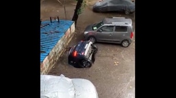 The image is a screengrab of the viral video showing the sinking car in Mumbai's Ghatkopar area.