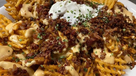 BBQ chicken waffle fries: You cannot go wrong with this dish. With just minimal ingredients, this dish can become the party saviour.  (Instagram/wickedwingskennesaw)