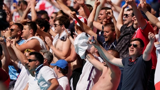 England supporters celebrate at the end of the Euro 2020 match.(AP)