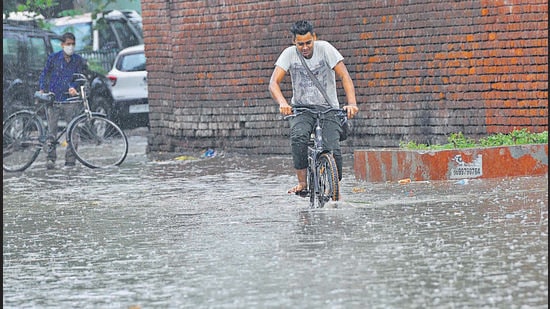 Chandigarh, India June 13, 2021: Commuters on their way in heavy rain in Chandigarh on Sunday morning, June 13, 2021. Photo by Keshav Singh/Hindustan Times.