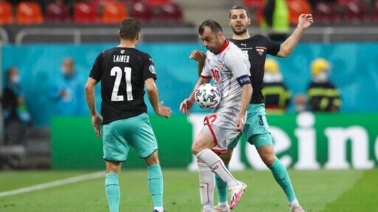 From left, Austria's Stefan Lainer, North Macedonia's Goran Pandev, and Austria's Aleksandar Dragovic. (AP)
