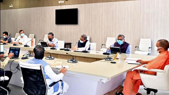 Uttar Pradesh chief minister Yogi Adityanath chairing a Covid-19 review meeting in Lucknow. (ANI)