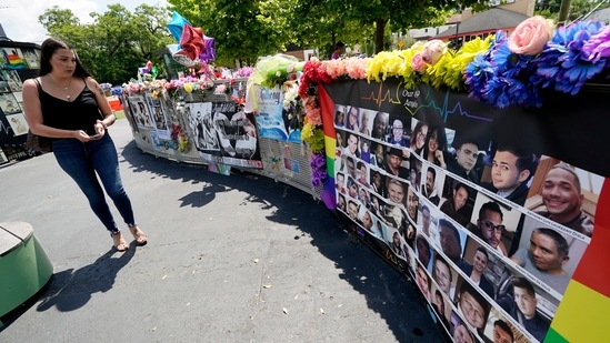 A visitor looks over a display with the photos and names of the 49 victims that died at the Pulse nightclub memorial.(AP) A visitor looks over a display with the photos and names of the 49 victims that died at the Pulse nightclub memorial.(AP)