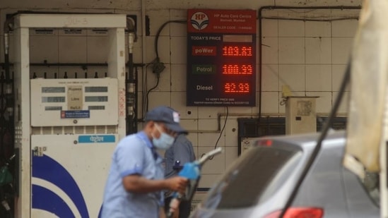 An attendant at a petrol pump fills the fuel tanks of motorists with rates displayed behind him on a digital screen, in Mumbai on Saturday.(Vijay Bate/HT Photo) An attendant at a petrol pump fills the fuel tanks of motorists with rates displayed behind him on a digital screen, in Mumbai on Saturday.(Vijay Bate/HT Photo)