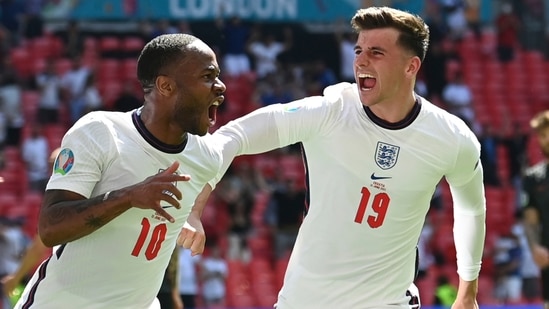 Raheem Sterling, left, celebrates with Mason Mount after scoring his side's opening goal during the Euro 2020 soccer championship group D match between England and Croatia at Wembley stadium in London.(AP)