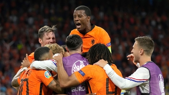 Netherlands players celebrate after Denzel Dumfries of the Netherlands scored his side's third goal.(AP)